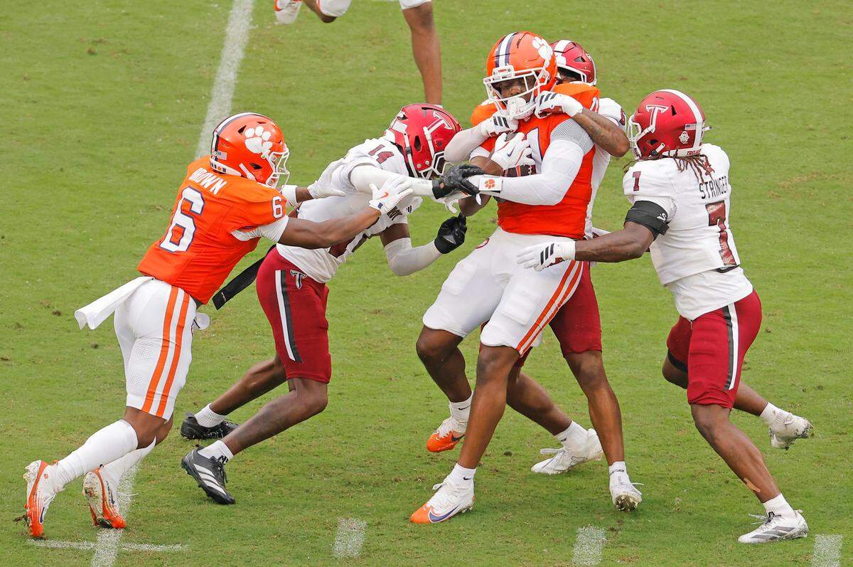 Clemson tight end Olsen Patt-Henry (11) is wrapped up by Troy during first-half action in Clemson, S.C on Saturday, Sept. 6, 2025.