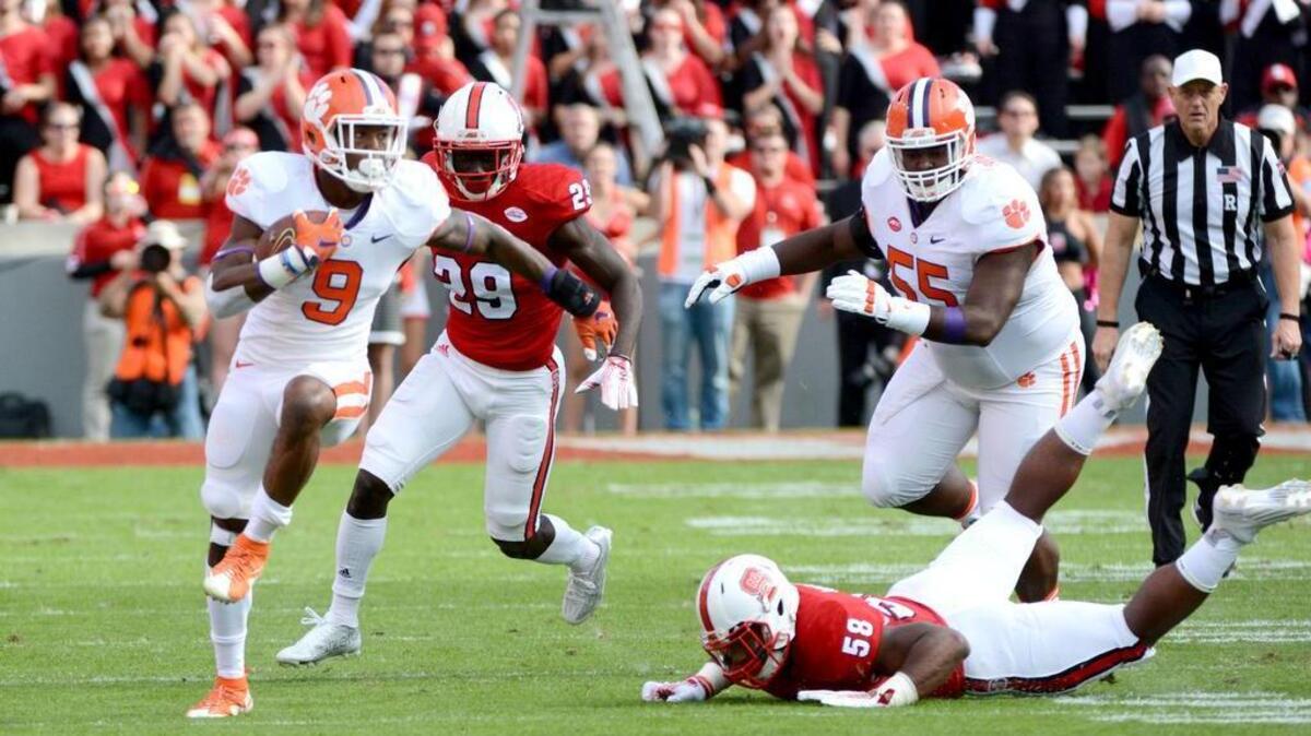Clemson running back Wayne Gallman (9) runs the ball during the first half against the North Carolina State Wolfpack at Carter Finley Stadium. Mandatory Credit: Rob Kinnan-USA TODAY Sports