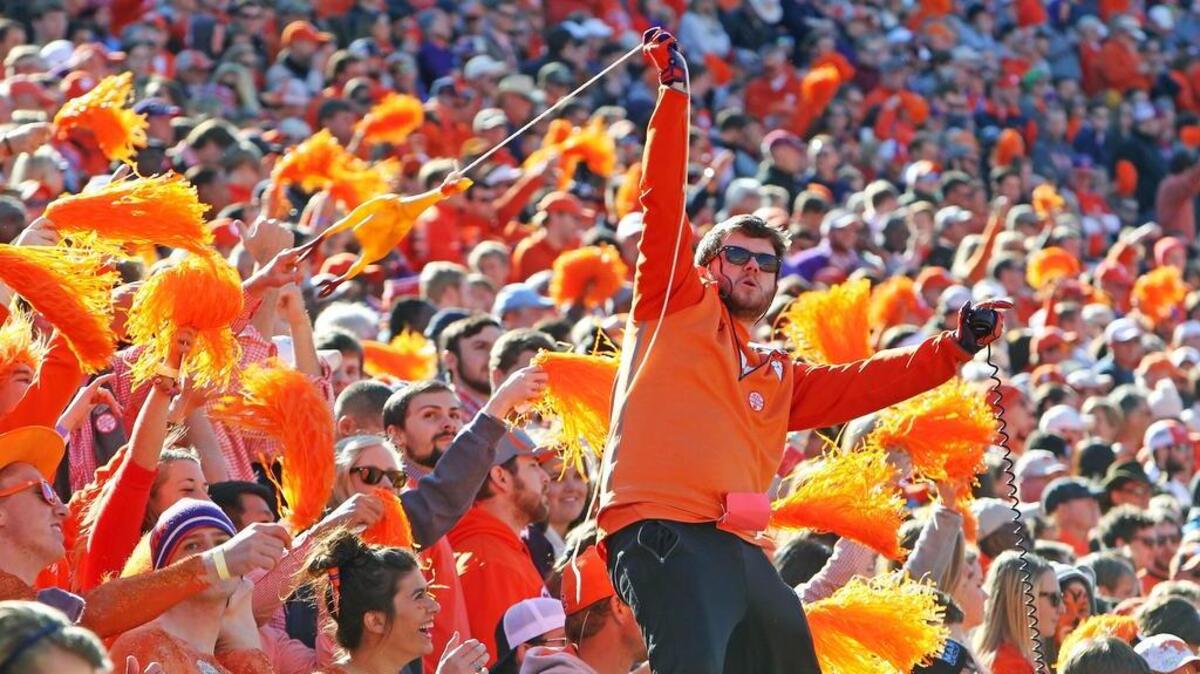 
A Clemson fan holds up a rubber chicken as he cheers for the Tigers in the first half at Memorial Stadium in Clemson, SC, Saturday, November 29, 2104.

