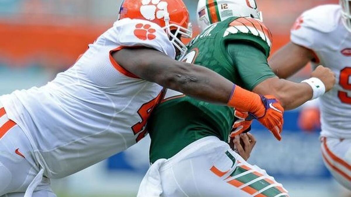 Clemson defensive tackle D.J. Reader (48) sacks Miami quarterback Malik Rosier (12) during the 2nd quarter Saturday, Oct. 24, 2015, in Miami Gardens, Fla.