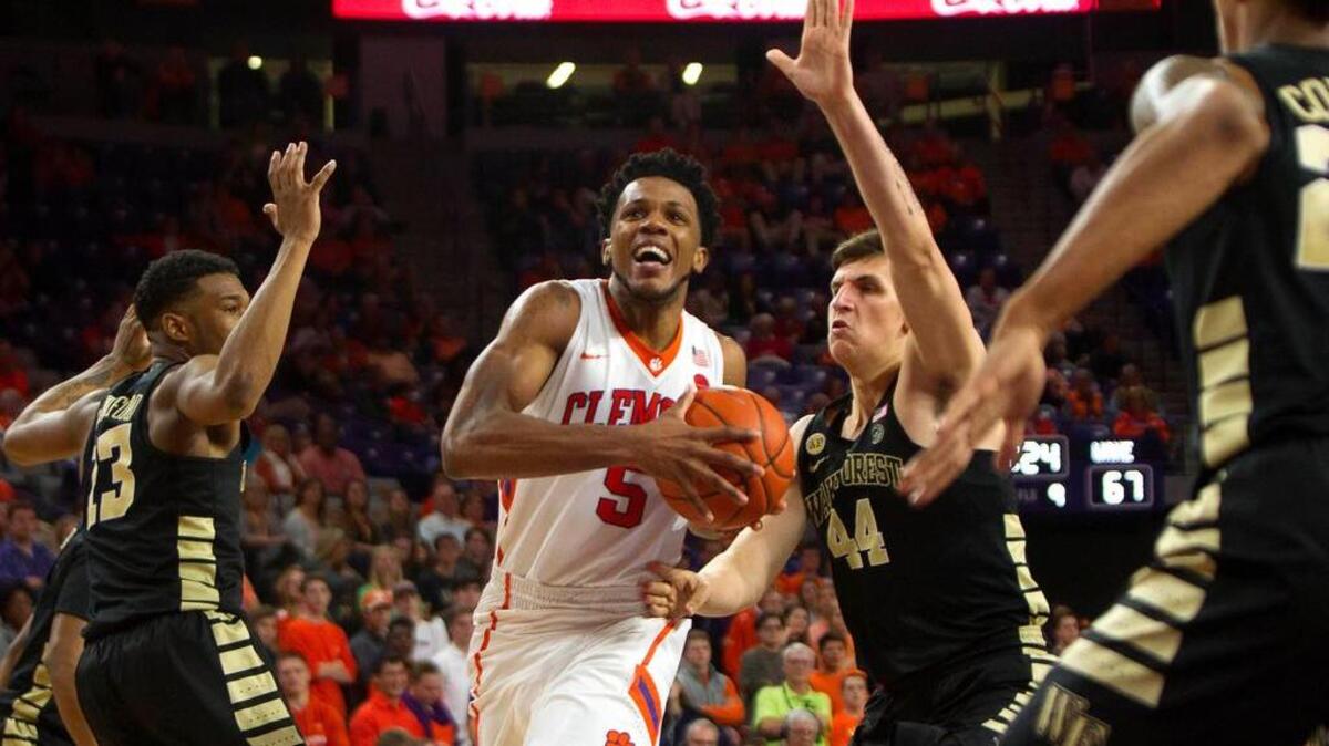 Jaron Blossomgame drives to the basket for two of his 17 points in the Tigers’ win.
