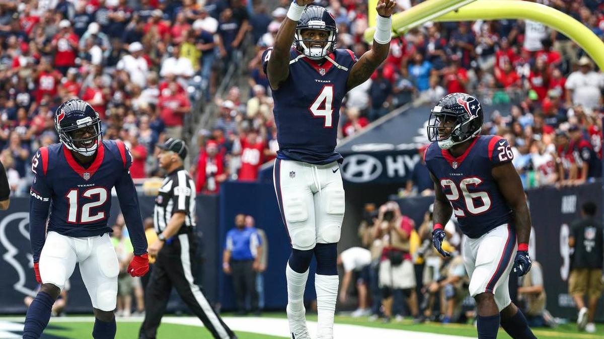 Houston Texans quarterback Deshaun Watson (4) celebrates after scoring a touchdown during the second quarter against the Tennessee Titans at NRG Stadium.