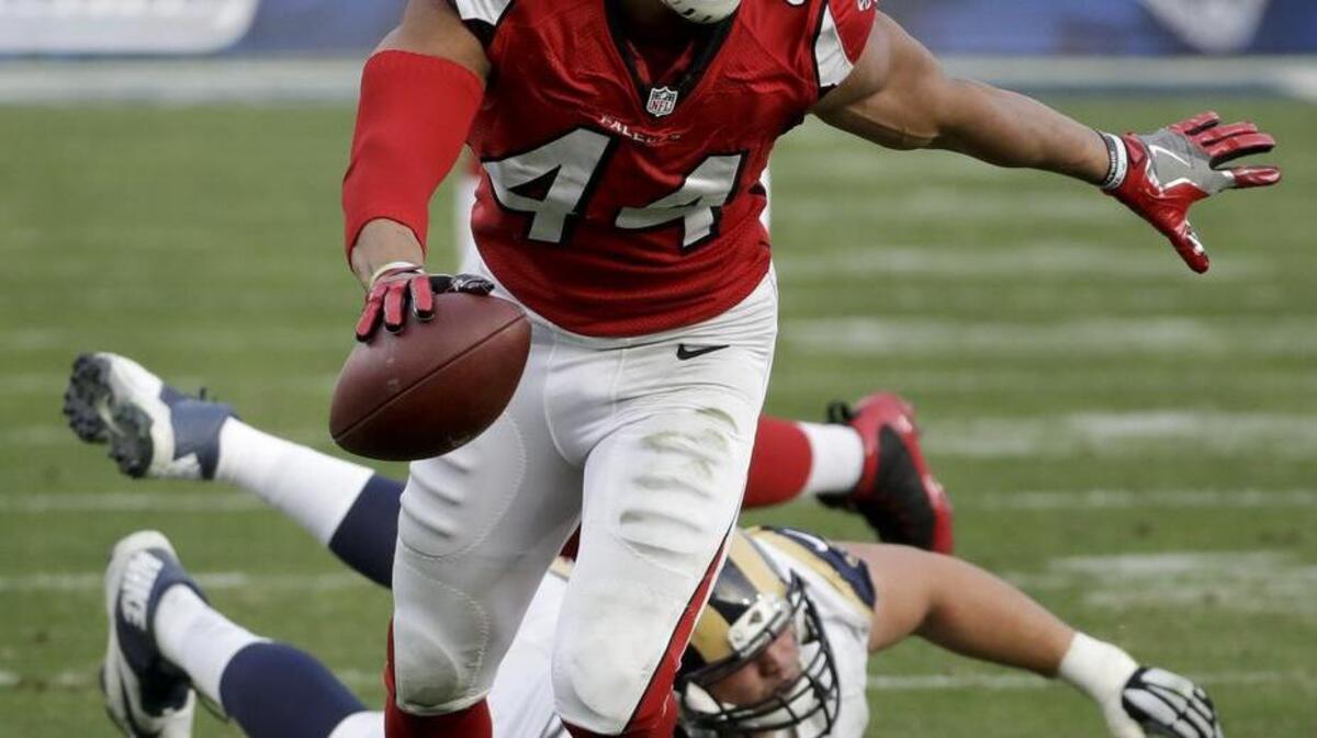 Former Clemson player Vic Beasley runs for a TD against the L.A. Rams in Sunday after a sack.