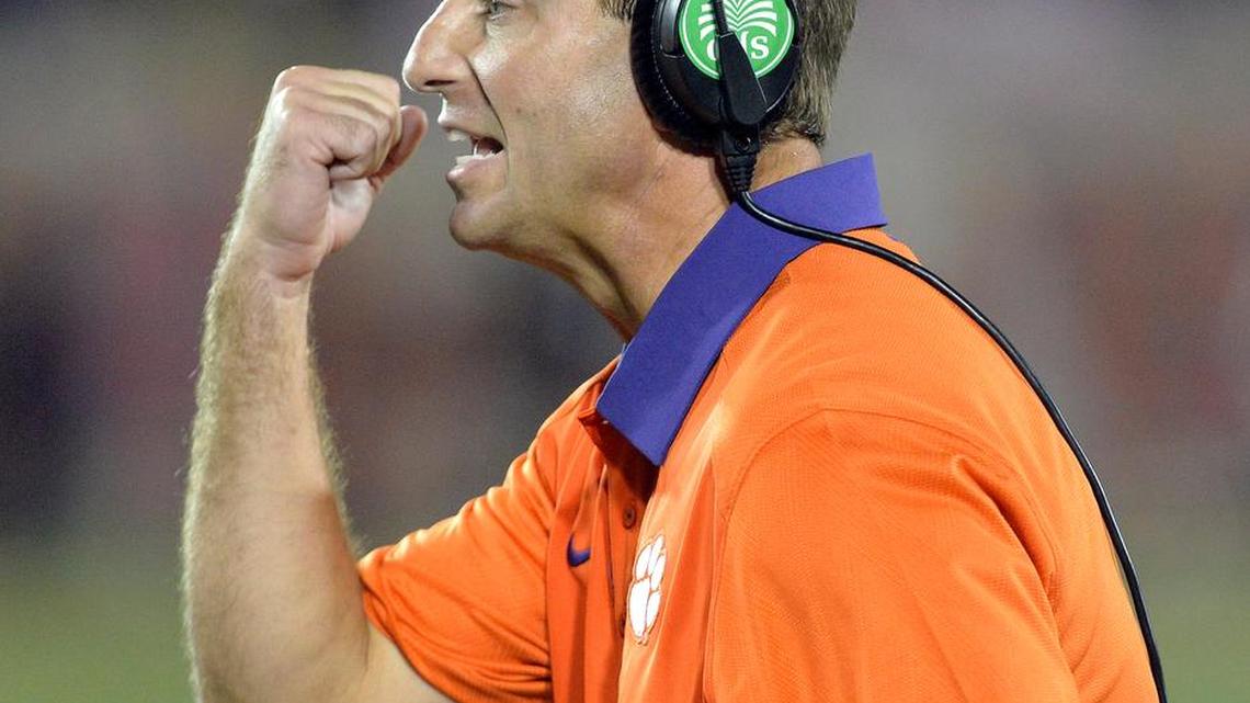 
FILE - In this Sept. 17, 2015, file photo, Clemson coach Dabo Swinney gestures to his team during the second half of an NCAA college football game against Louisville in Louisville, Ky. One month into the season, the ACC looks as top-heavy as ever with three-time defending champion Florida State and Clemson the league’s only ranked teams. This was not the plan coming into the season. (AP Photo/Timothy D. Easley, File)
