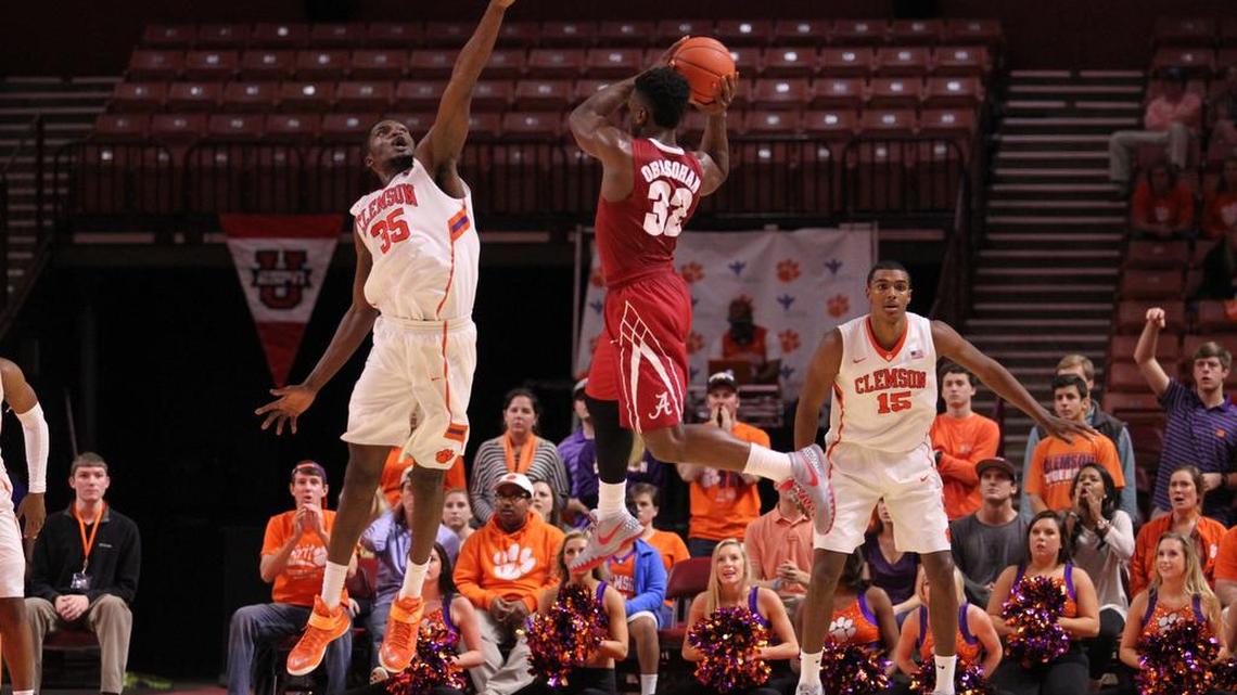 Alabama guard Retin Obasohan shoots over Clemson center Landry Nnoko in second half of the Crimson Tide’s 51-50 win Sunday.