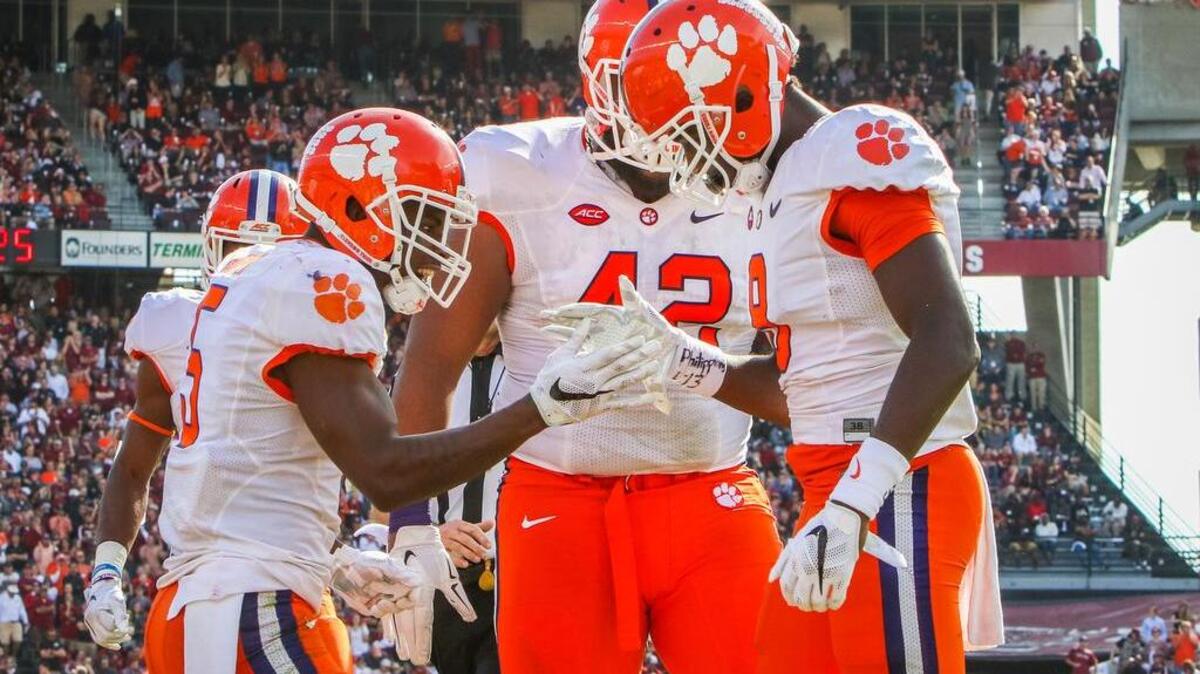 Clemson wide receiver Germane Hopper (5) congratulates Deon Cain (8) after a catch on Saturday.