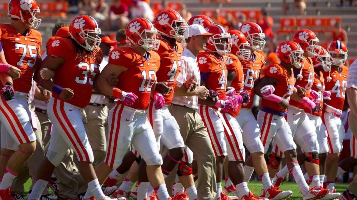 
Clemson Tigers defensive coordinator Brent Venables (center) with players prior to the game against the Louisville Cardinals at Clemson Memorial Stadium. Mandatory
