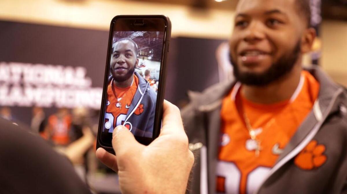 Clemson Tigers defensive end Kevin Dodd does an interview during Media Day at the Phoenix Convention Center before national championship game against Alabama in January, 2016.