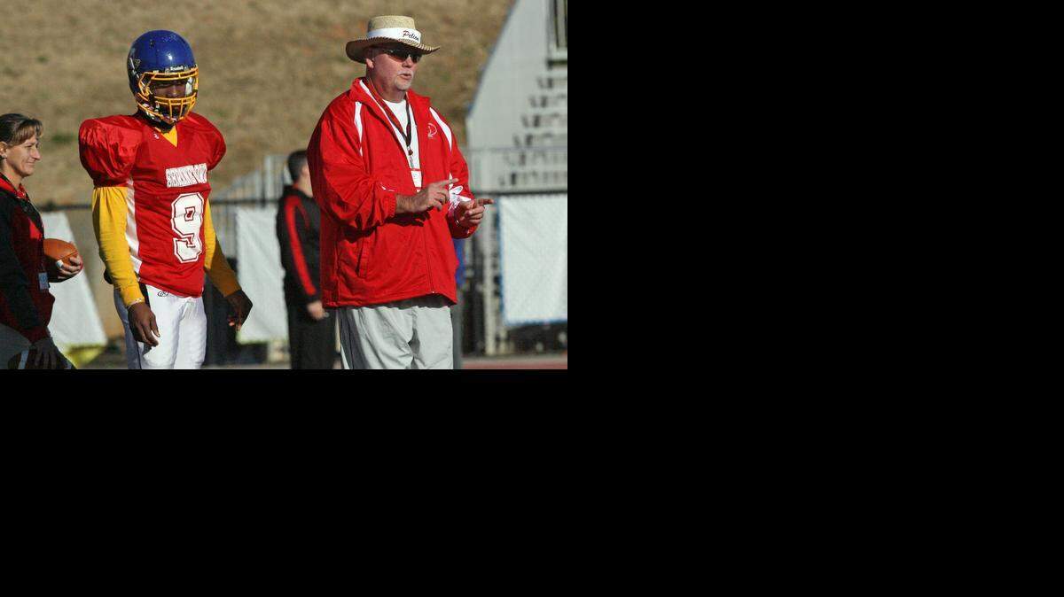 
Pelion High coach Ben Freeman stands with Wren quarterback and Clemson commitment Kelly Bryant at Shrine Bowl practice at Spartanburg High School in December. Bryant is competing for the backup quarterback spot at Clemson this spring.
