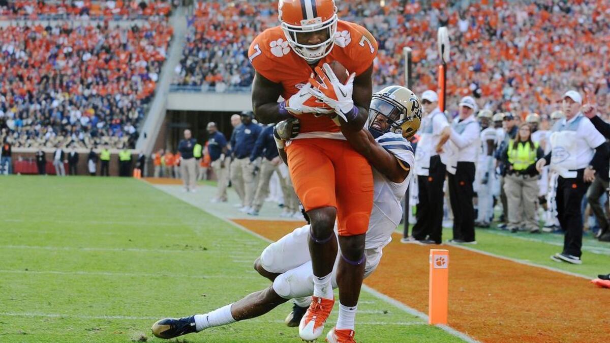 Clemson wide receiver Mike Williams (7) scores a touchdown as Pittsburgh defensive back Dane Jackson (11) defends during the first half of an NCAA college football game on Saturday, Nov. 12, 2016, in Clemson, S.C.