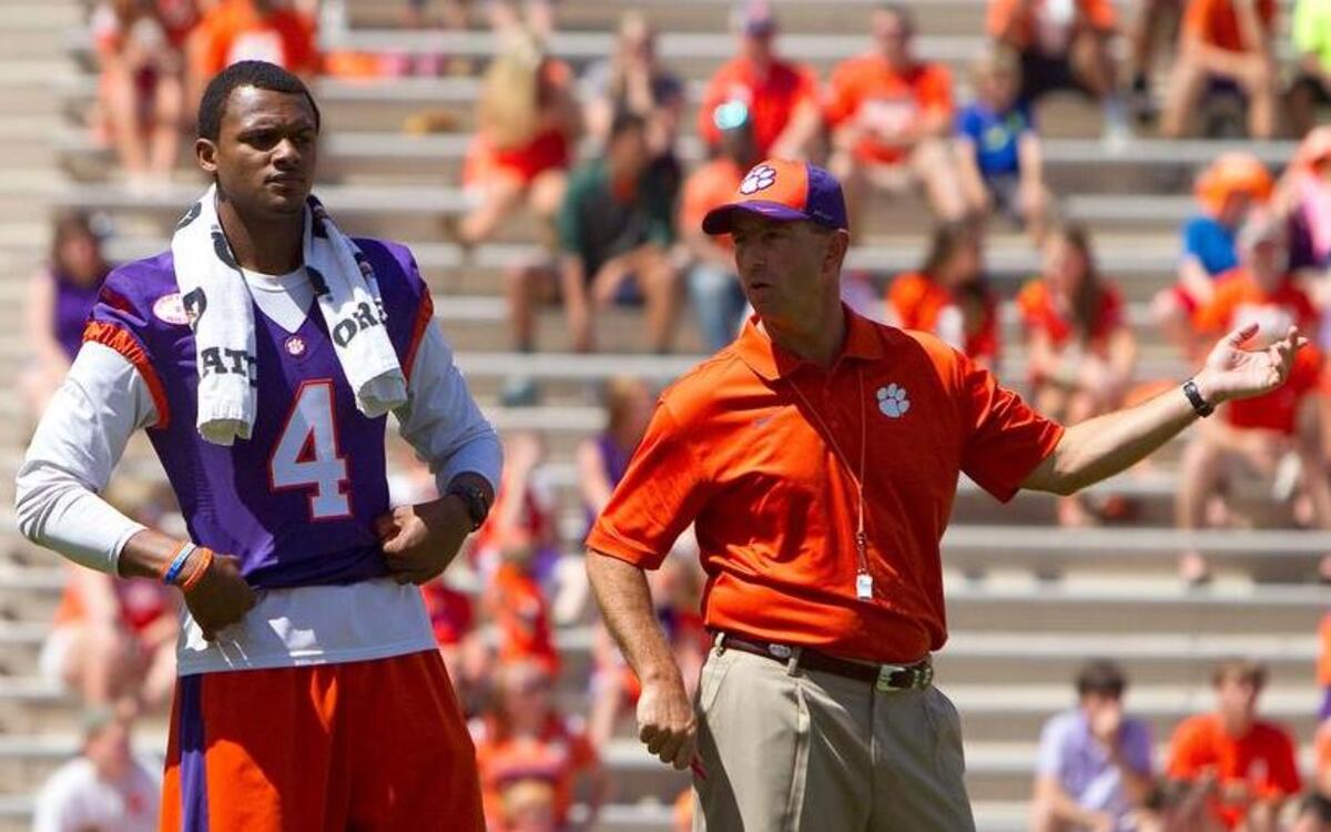 
Clemson Tigers head coach Dabo Swinney (right) and quarterback Deshaun Watson (4) look on as quarterback Nick Schuessler (12) throws during the first half of the Clemson spring game at Clemson Memorial Stadium. 
