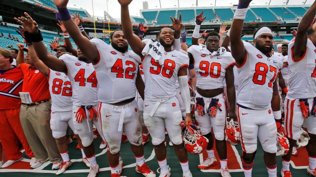 Clemson players celebrate after their 58-0 win over Miami.