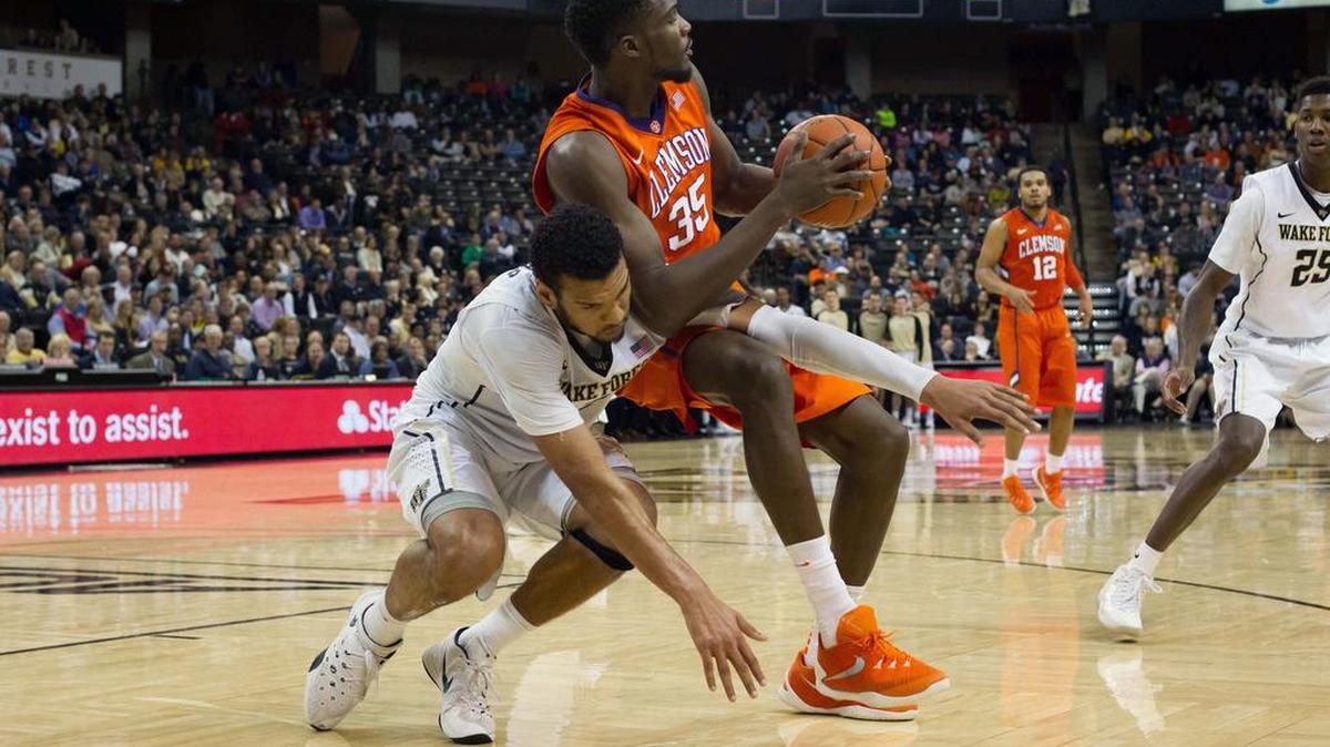 Wake Forest forward Devin Thomas tries to get the ball from Clemson center Landry Nnoko during a game earlier this season.