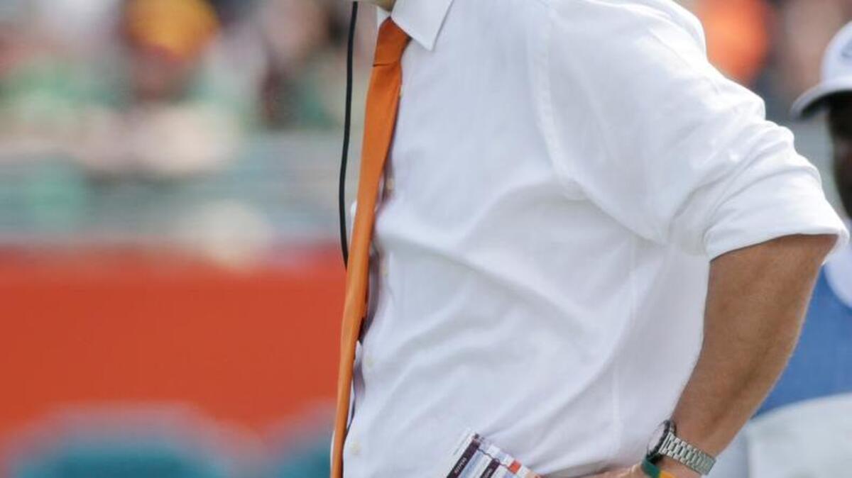 Miami head coach Al Golden watches a play during the first half of an NCAA College football game against Clemson, Saturday, Oct. 24, 2015 in Miami Gardens, Fla. There was booing and a "Fire Golden" chant from the sparse crowd even before the first quarter ended, and the stands were largely empty by the midpoint of the third quarter as Clemson defeated Miami 58-0.