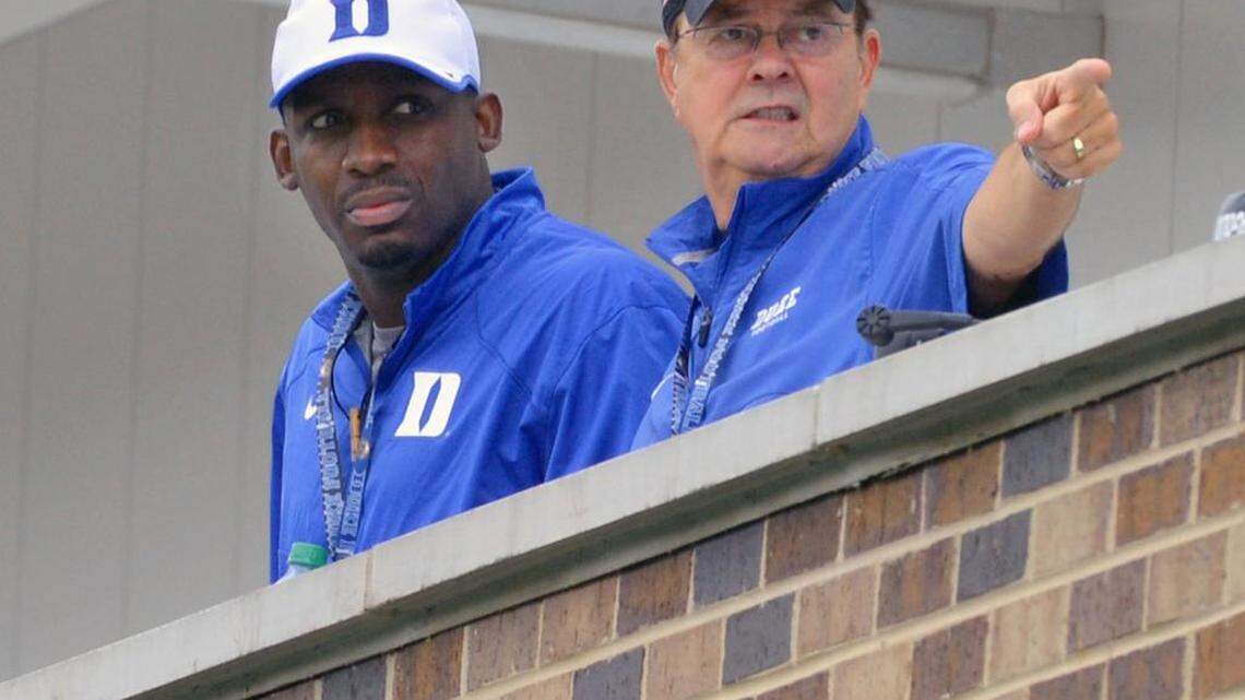 Duke offensive coordinator Scottie Montgomery, left, is set to become the next head football coach at East Carolina, according to multiple reports. He is shown with Blue Devils head coach David Cutcliffe in August 2014.
