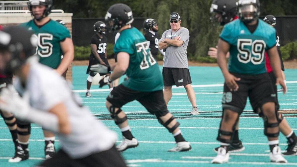 
Coastal Carolina coach Joe Moglia watches his players during a recent practice.
