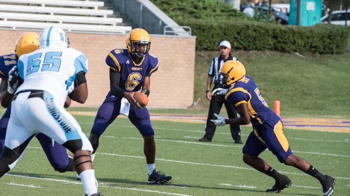 Benedict quarterback Mason Duckett hands off to running back George Myers Jr. during the Tigers’ win over Livingstone in the Palmetto Capital City Classic on Saturday.