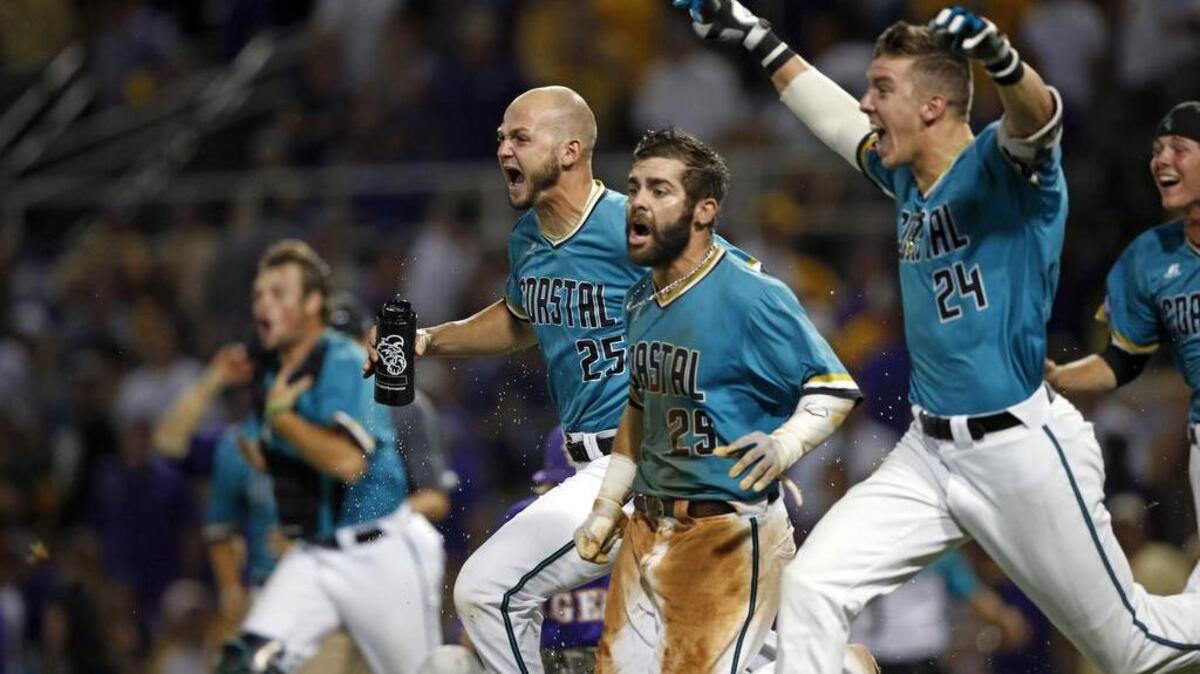 Coastal Carolina's Anthony Marks (29) reacts after sliding into home plate to score the winning run in the bottom of the ninth inning of an NCAA college baseball tournament super regional game against LSU in Baton Rouge, La., Sunday, June 12, 2016. Coastal Carolina won 4-3 to advance to the College World Series.