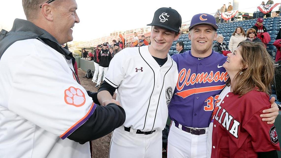 
Parents Renee and Dwight Schmidt spend some time with their sons, South Carolina’s Clarke Schmidt and Clemson’s Clate Schmidt, after a game in February. 
