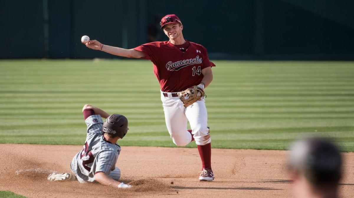 South Carolina shortstop Madison Stokes turns a double play against Mississippi State's Hunter Vansau at Founders Park on Sunday. South Carolina defeated Mississippi State 6-1.