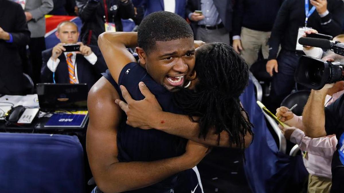 Villanova forward Kris Jenkins is embraced by his mother, Columbia’s Felicia Jenkins, after the national championship game.