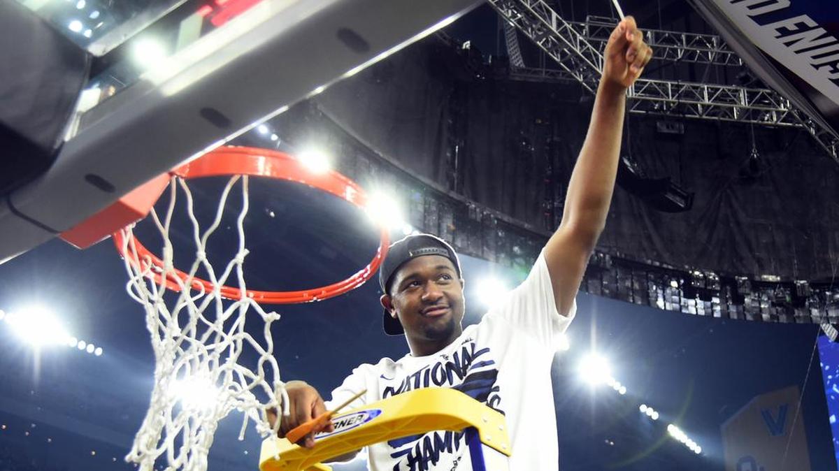 Villanova Wildcats forward Kris Jenkins (2) cuts down the net after beating the North Carolina Tar Heels in the NCAA championship game