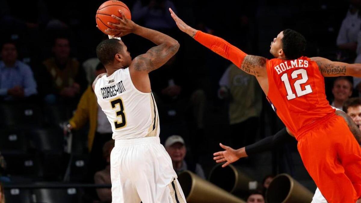 Georgia Tech guard Marcus Georges-Hunt (3) attempts a shot against Avry Holmes. Georges-Hunt scored 25 points to lead the Yellow Jackets to a win.