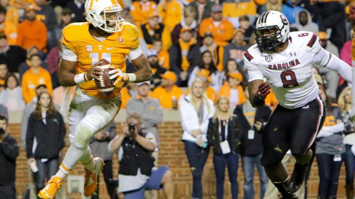 South Carolina defensive end Marquavius Lewis pressures Tennessee quarterback Joshua Dobbs on Saturday.