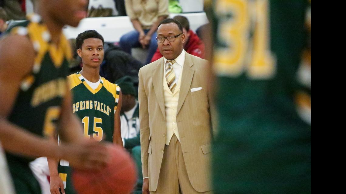 
PJ Dozier (15) with his dad and head coach at Spring Valley, Perry Dozier
