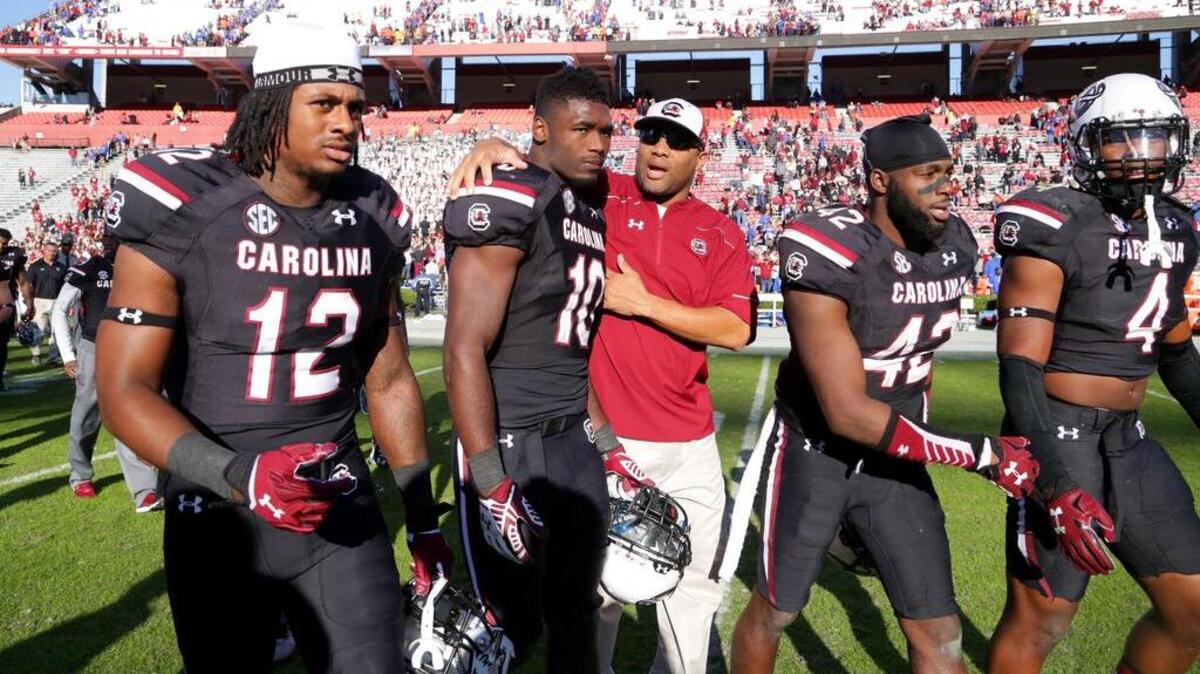South Carolina players leave the field after another close loss.