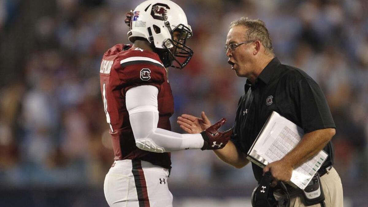
USC linebacker Bryson Allen-Williams (4) talks with special teams coordinator Joe Robinson in the second half of the Belk College Kickoff in Charlotte, NC, Thursday.
