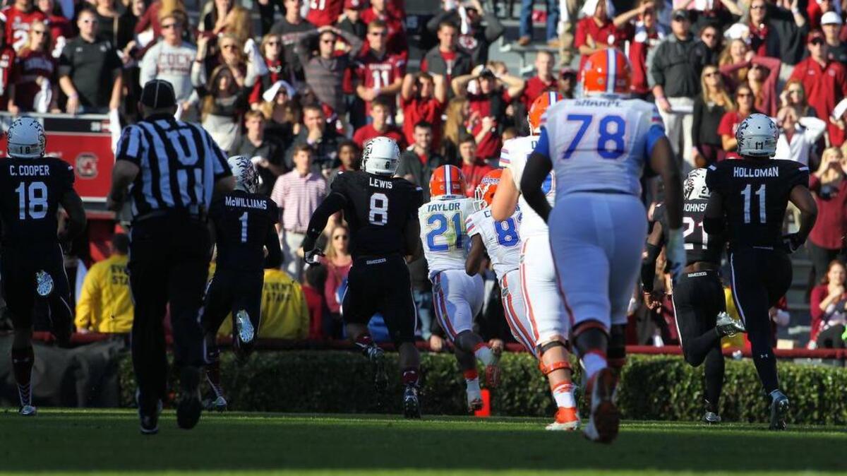 Florida running back Kelvin Taylor (21) breaks free for a long run in the fourth quarter to set up the Gators’ final score Saturday.
