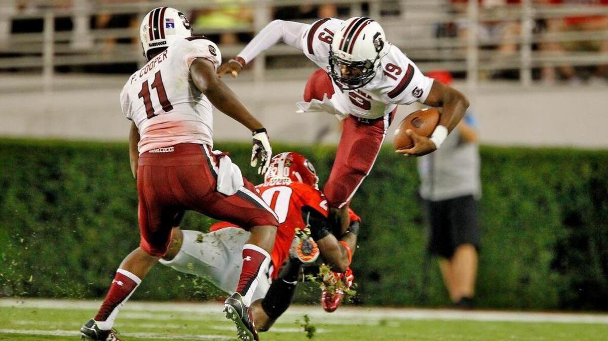 
South Carolina quarterback Lorenzo Nunez is stopped on a keeper in the second half against Georgia at Sanford Stadium on Saturday.
