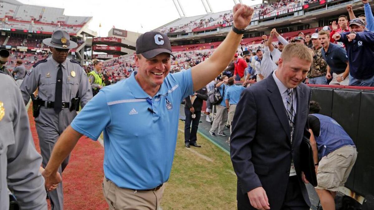 The Citadel coach Mike Houston celebrates his win over South Carolina.