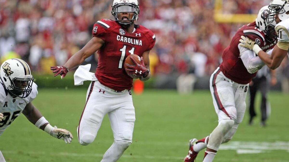 
Lorenzo Nunez, right, blocks for Pharoh Cooper on Cooper’s 29-yard touchdown run against UCF.
