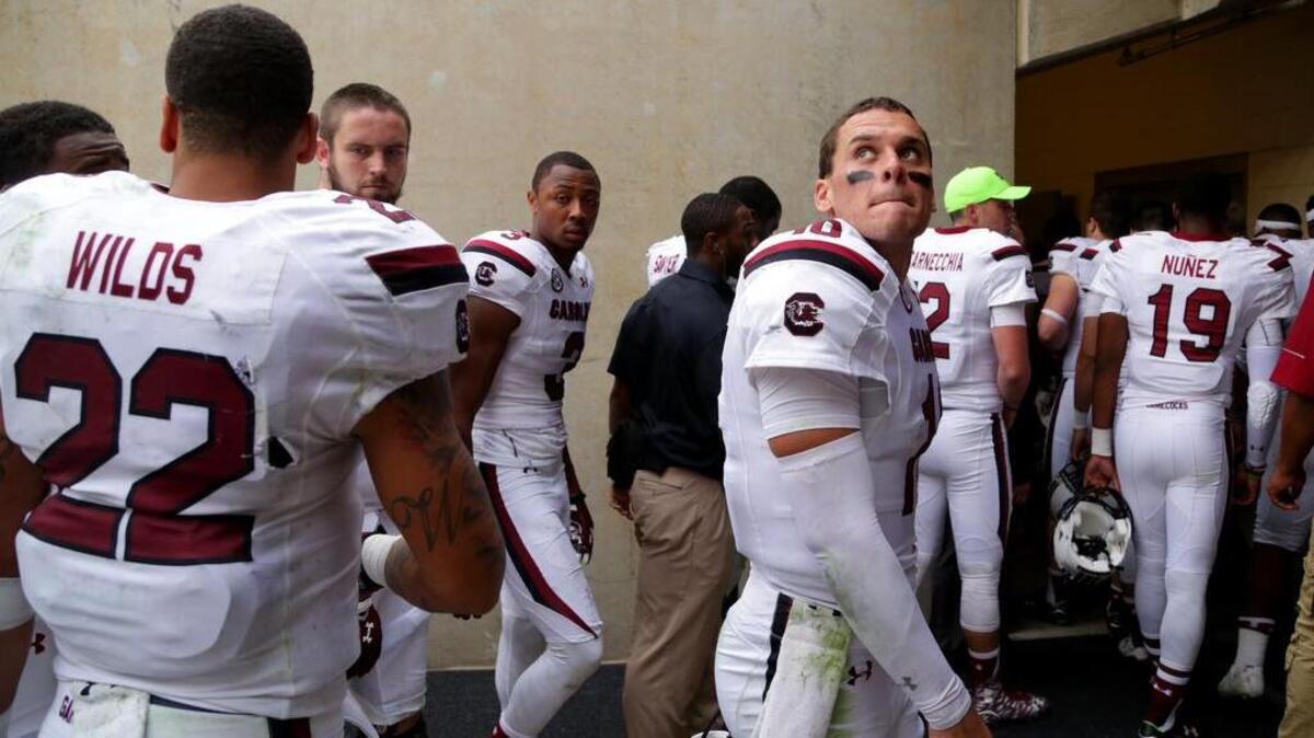 South Carolina quarterback Perry Orth (10) looks back as he walks off the field after a loss to Texas A&M on Saturday.