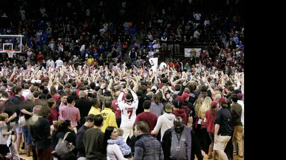 
South Carolina fans stormed the court after South Carolina defeated No. 17 Kentucky 72-67 on March 1, 2014, in Columbia.
