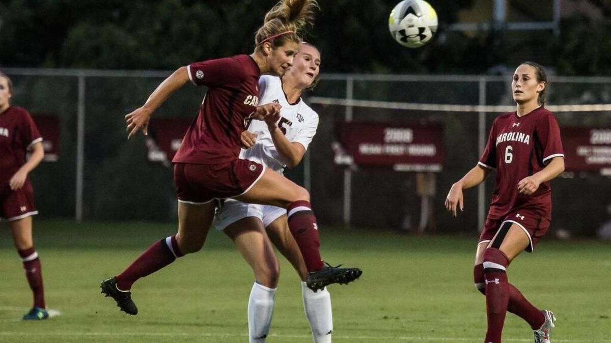 
South Carolina’s Dominique Babbit, left, battles Texas A&M’s Brittany Crabtree during the first half of a top 20 showdown Thursday night at Stone Stadium.
