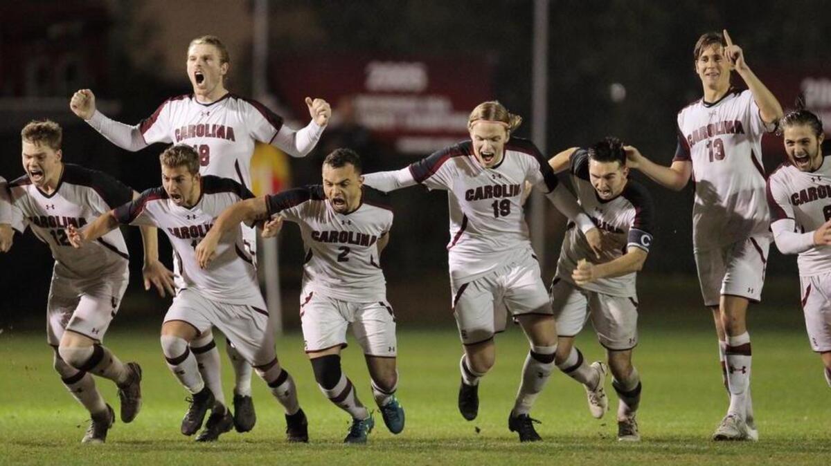The South Carolina men’s soccer team celebrates its win over Furman in the NCAA Tournament.