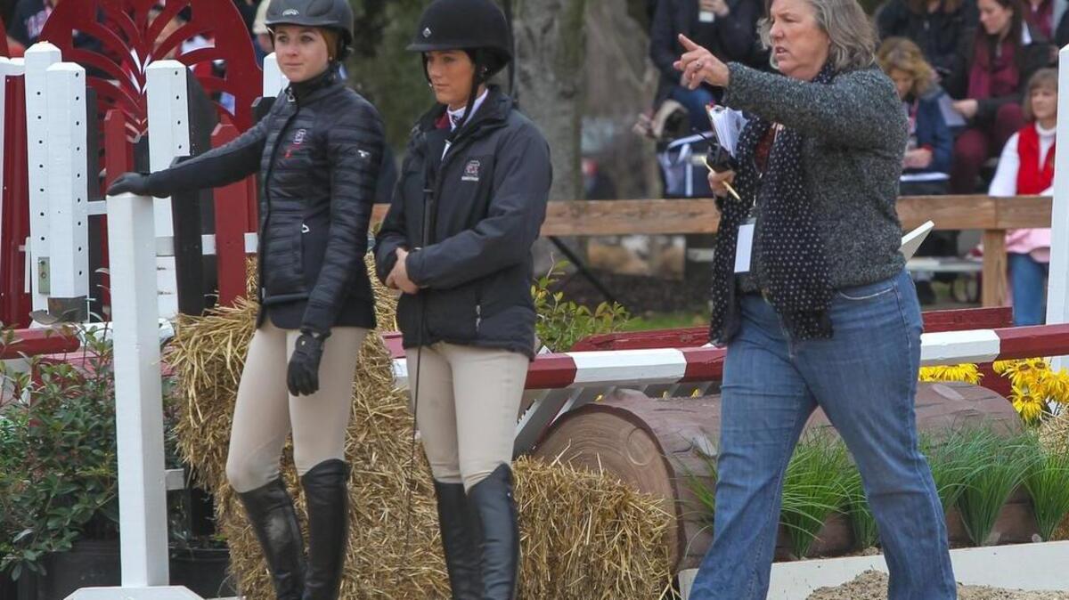South Carolina equestrian coach Boo Major talks with Samantha Smith and Adele Norton during the SEC tournament in Blythewood.