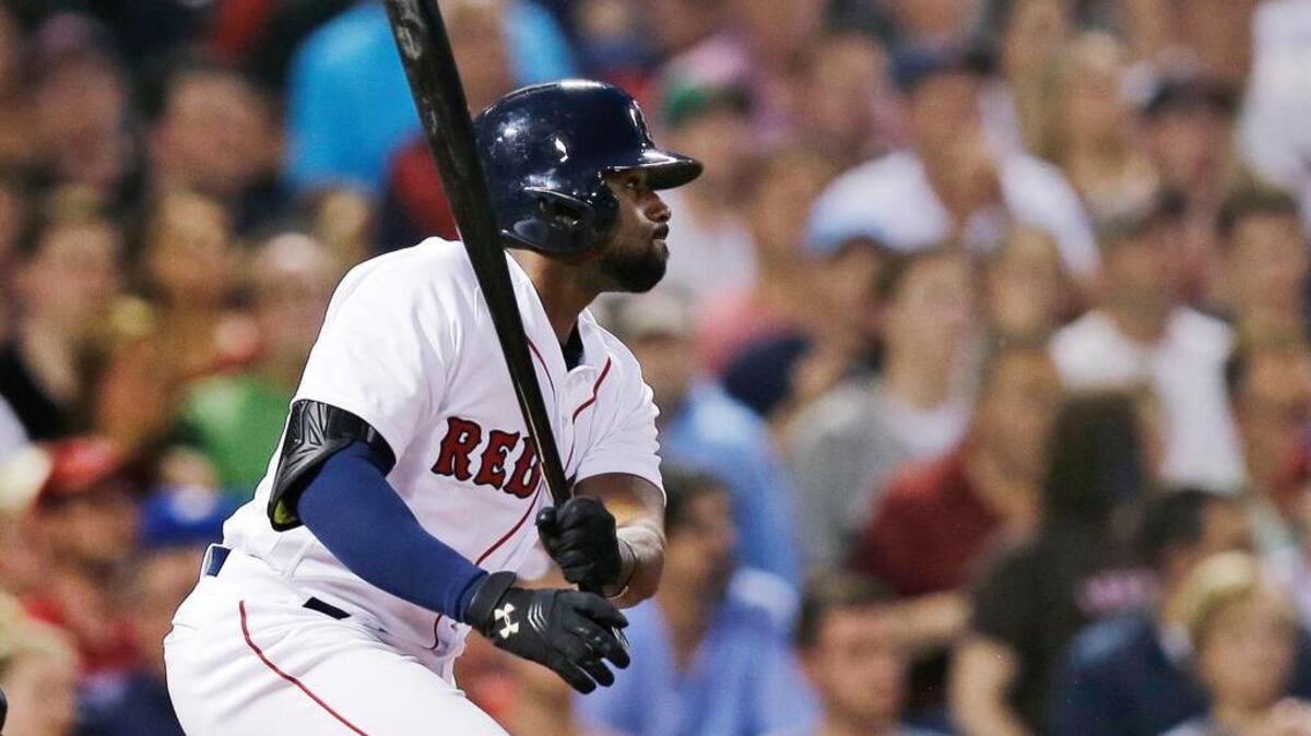 Boston Red Sox's Jackie Bradley Jr. watches his single that extended his hitting streak to 29 games during the fourth inning Wednesday against the Colorado Rockies in Boston.