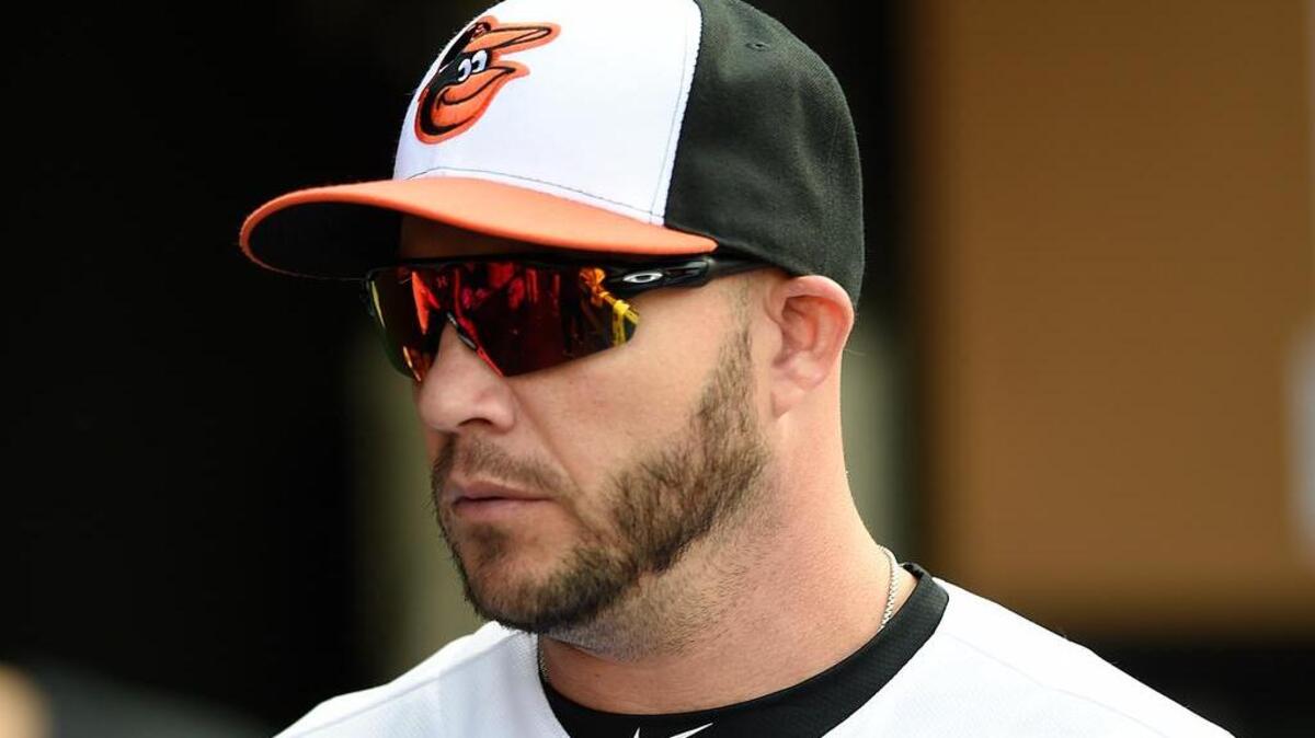Baltimore Orioles' Steve Pearce stands in the dugout before playing the Texas Rangers in a baseball in Baltimore, Tuesday.