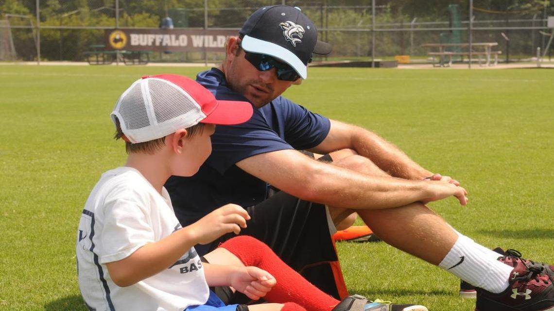 
Scott Wingo talks with a participant at the Wilmington Sharks youth baseball camp.
