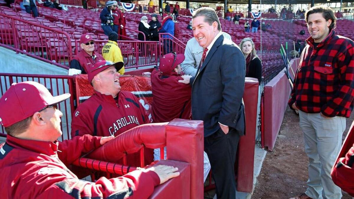 South Carolina coach Chad Holbrook, left, talkes with athletics director Ray Tanner.