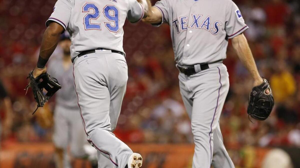 Texas Rangers relief pitcher Sam Dyson, right, is 1-2 with 28 saves and a 2.83 ERA.
