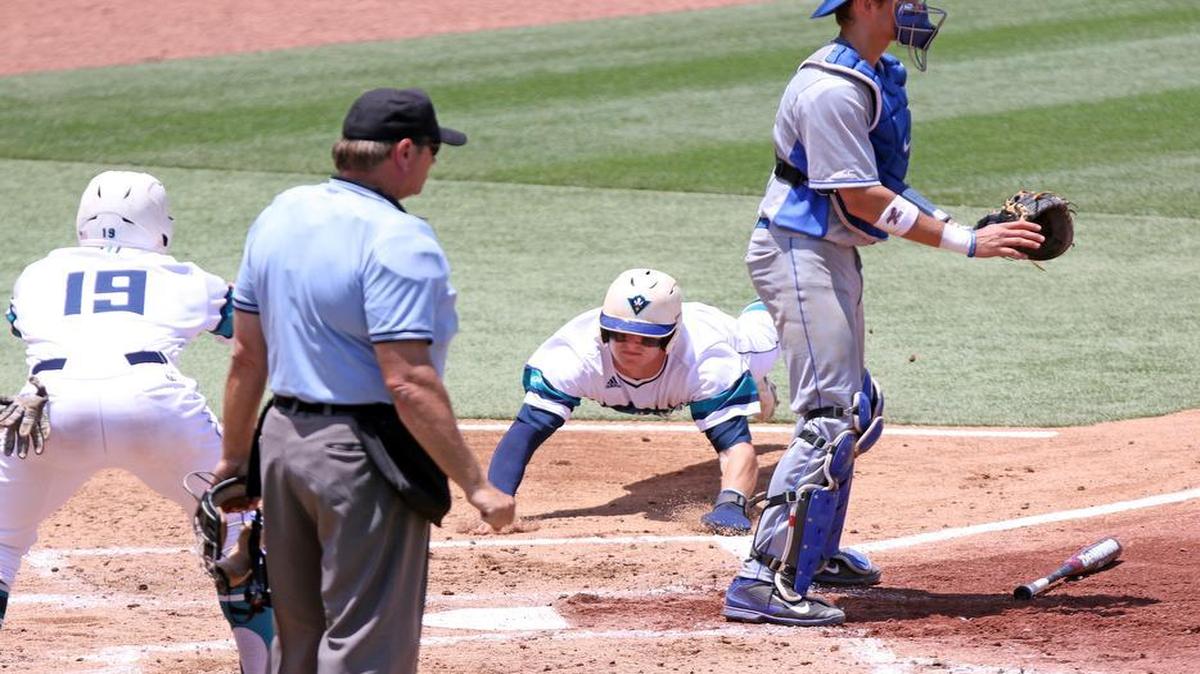UNCW outfielder Steven Linkous slides in to score during the Seahawks' 6-run second inning Friday against Duke in the NCAA Baseball Tournament regional at Founders Park in Columbia.