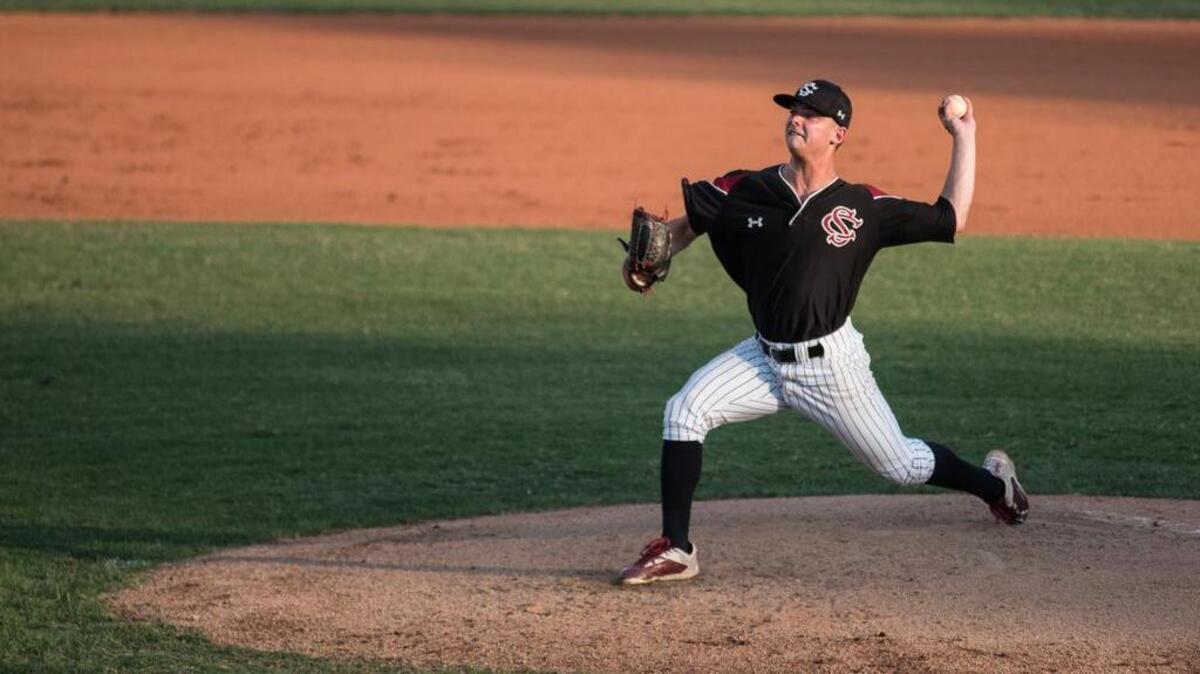 Former South Carolina pitcher Vince Fiori delivers to home plate during an exhibition game between Gamecock alumni and the Lexington County Blowfish on Friday night.