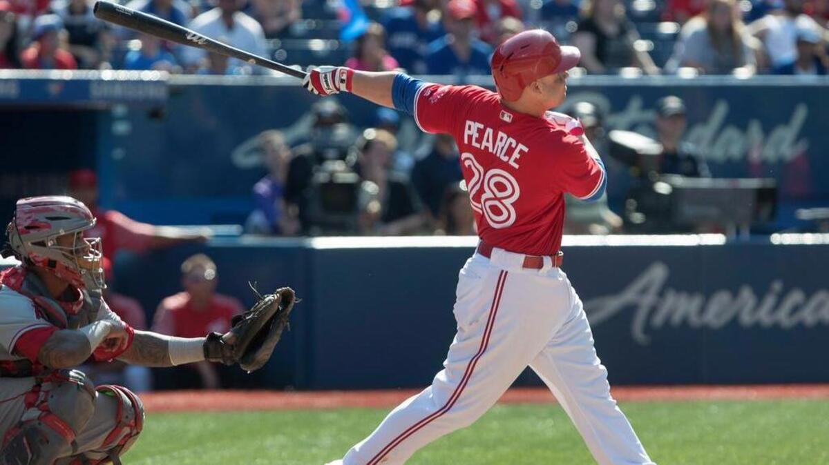 Toronto Blue Jays Steve Pearce, a former South Carolina player, hits a walk off grand slam in the ninth inning to defeat the Los Angeles Angels in a major league baseball game in Toronto on Sunday.