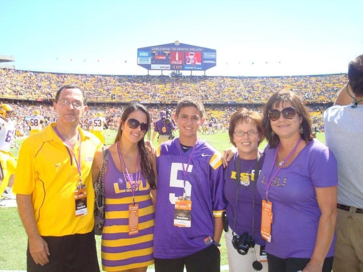 USC bullpen catcher John Hawkins (center in No. 5 jersey), who is a Stage IV Hodgkin's Lymphoma survivor, and his family attended an LSU game in 2010 as part of the Make-A-Wish program. Hawkins is now 6 years cancer free.