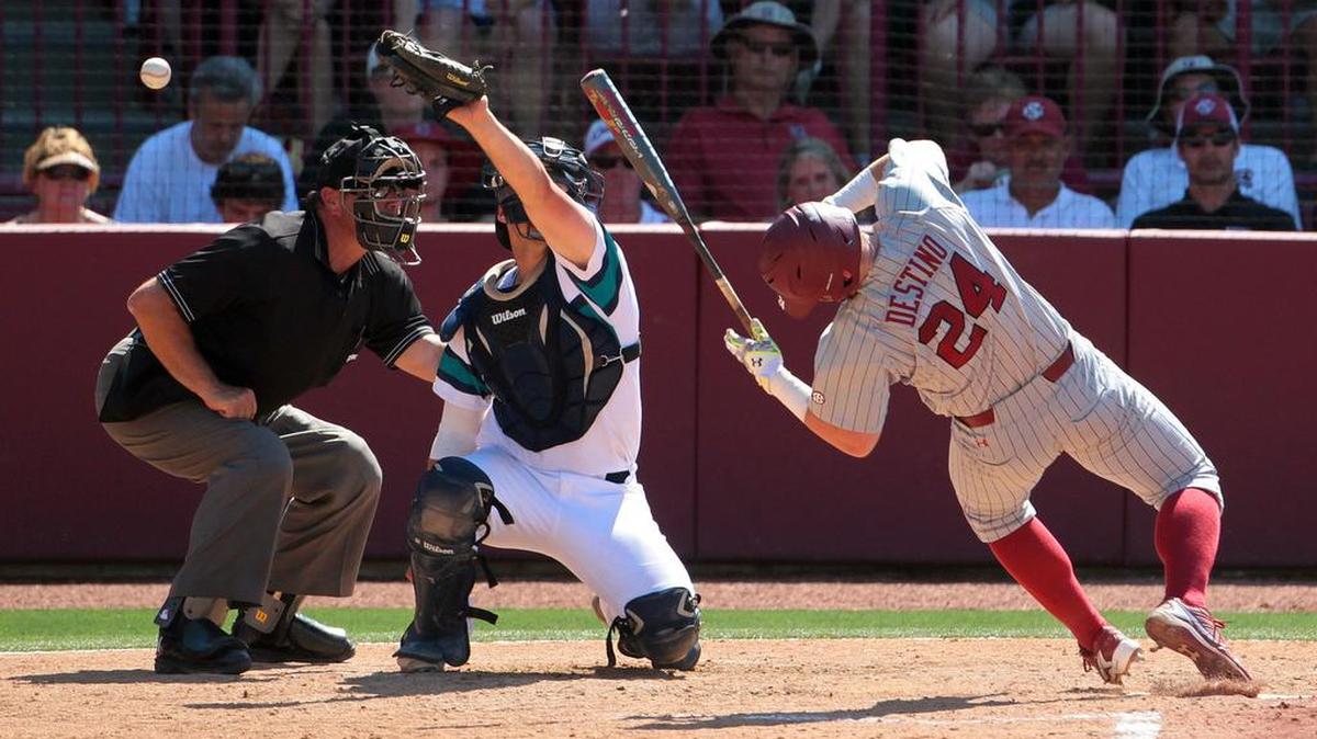 South Carolina’s Alex Destino contorts to avoid a high pitch during an at-bat against UNC Wilmington.